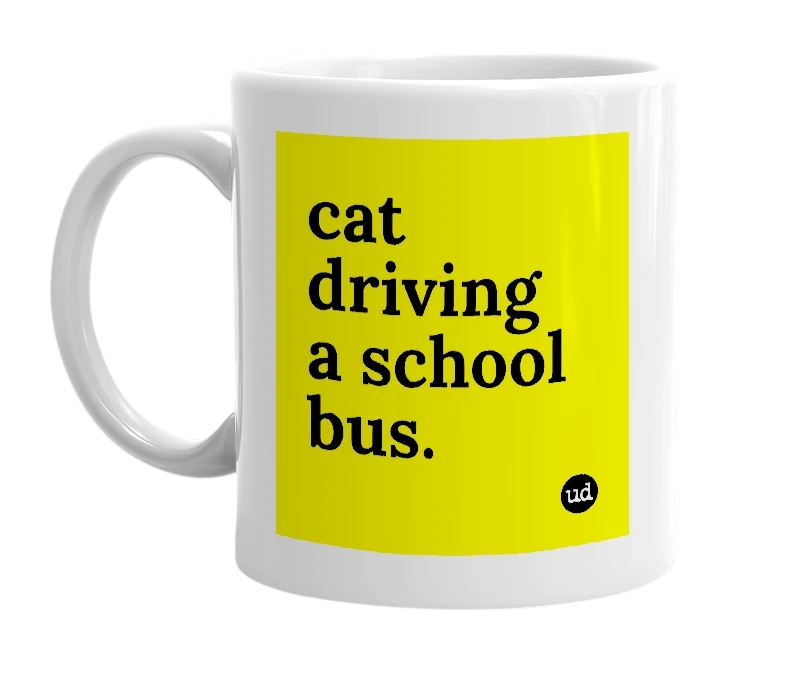 White mug with 'cat driving a school bus.' in bold black letters