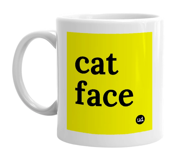 White mug with 'cat face' in bold black letters