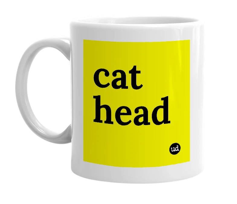 White mug with 'cat head' in bold black letters