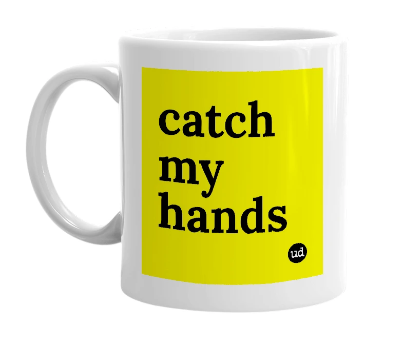 White mug with 'catch my hands' in bold black letters