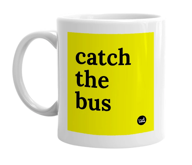 White mug with 'catch the bus' in bold black letters