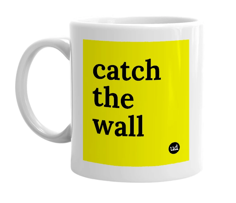 White mug with 'catch the wall' in bold black letters