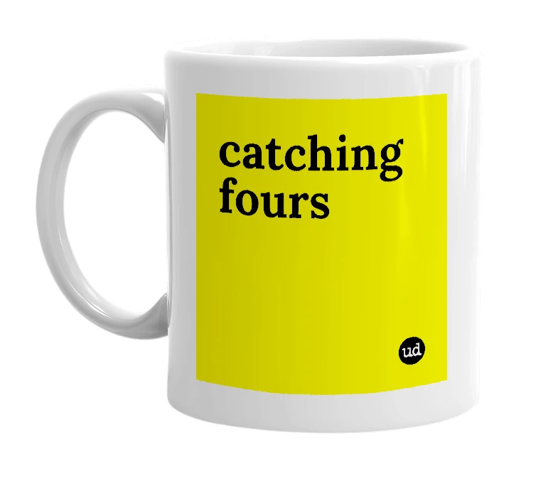 White mug with 'catching fours' in bold black letters