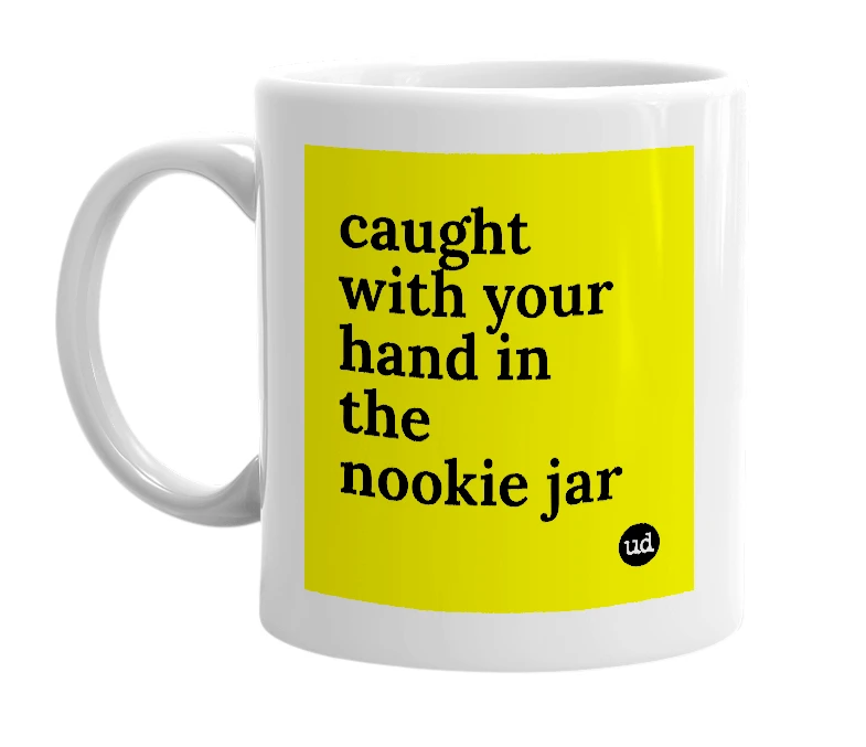 White mug with 'caught with your hand in the nookie jar' in bold black letters