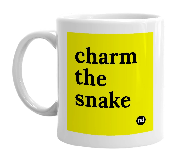 White mug with 'charm the snake' in bold black letters