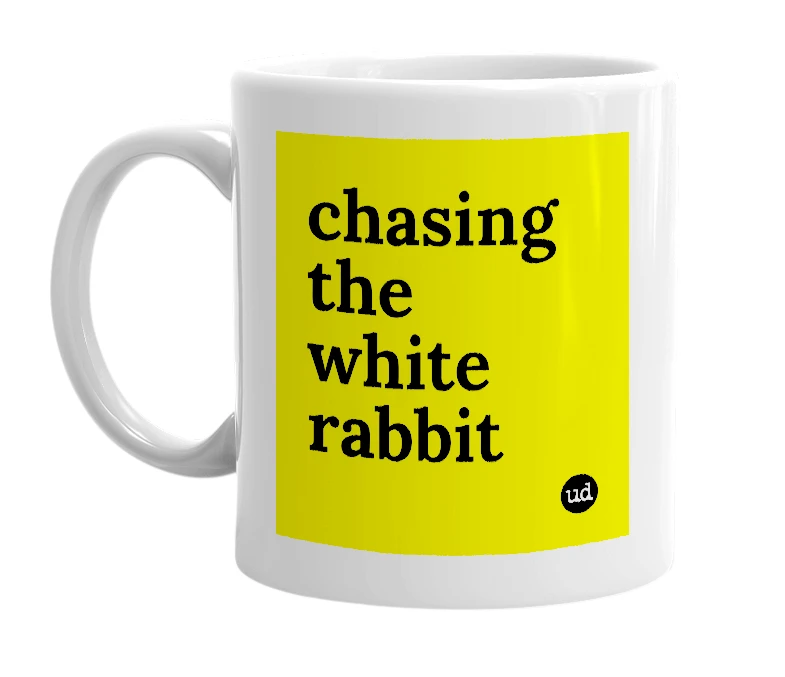 White mug with 'chasing the white rabbit' in bold black letters