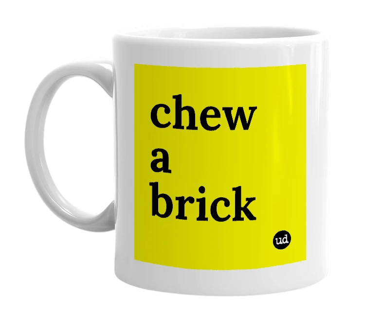 White mug with 'chew a brick' in bold black letters
