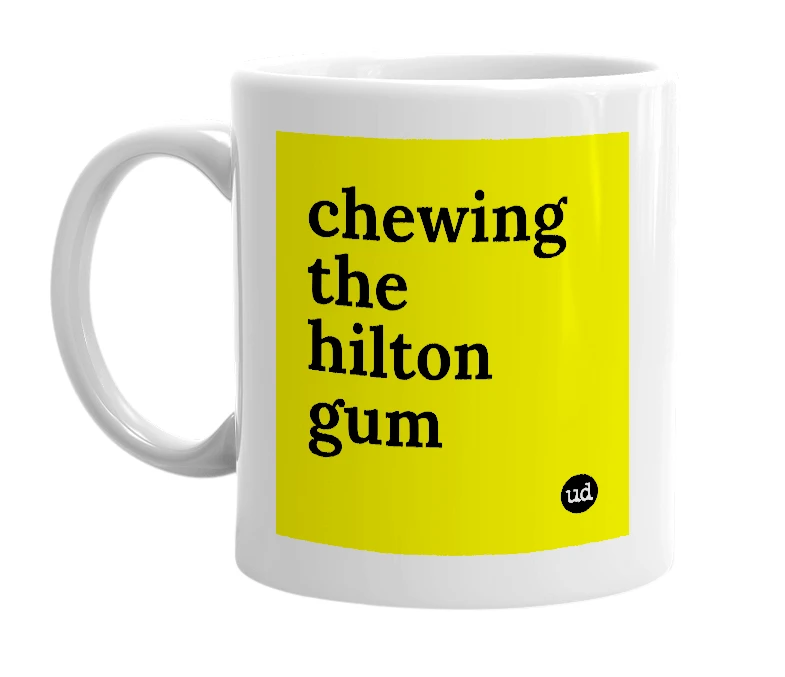 White mug with 'chewing the hilton gum' in bold black letters