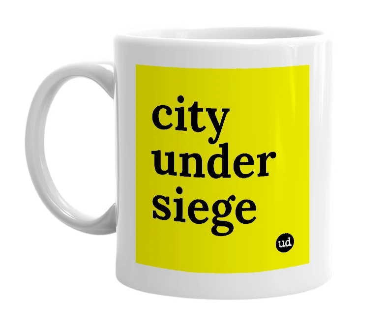 White mug with 'city under siege' in bold black letters