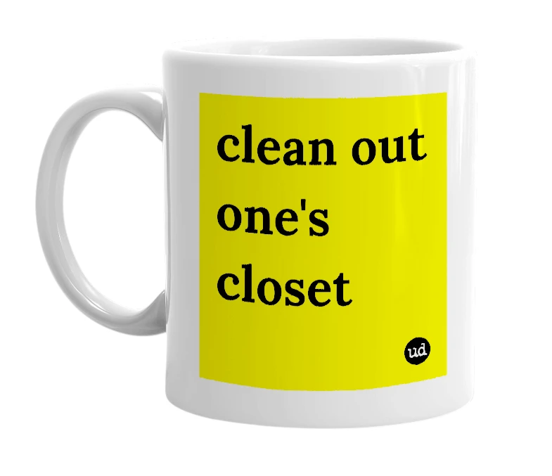 White mug with 'clean out one's closet' in bold black letters