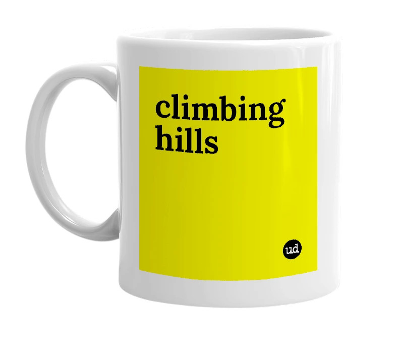 White mug with 'climbing hills' in bold black letters