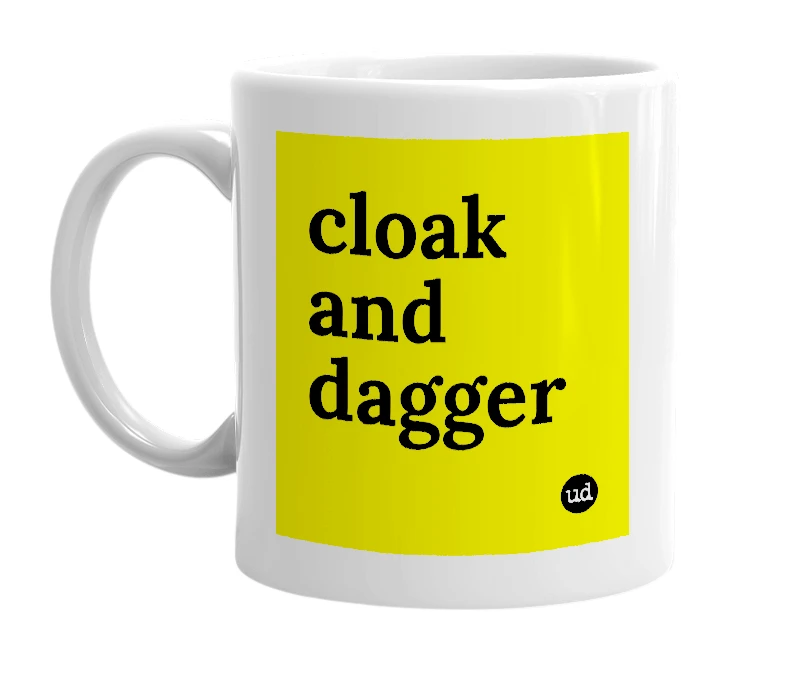 White mug with 'cloak and dagger' in bold black letters