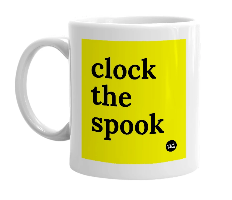 White mug with 'clock the spook' in bold black letters