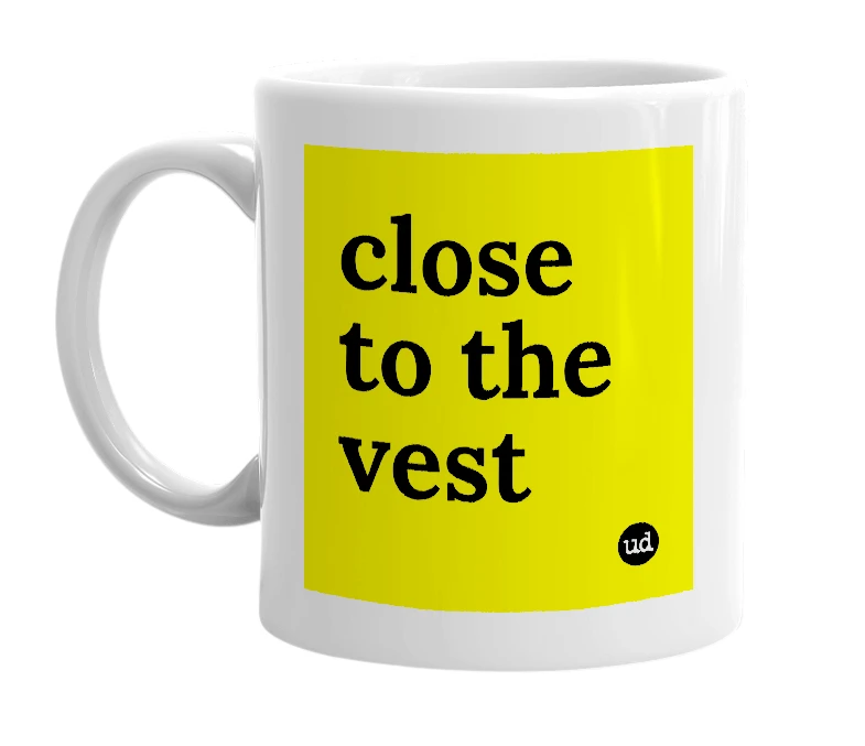 White mug with 'close to the vest' in bold black letters