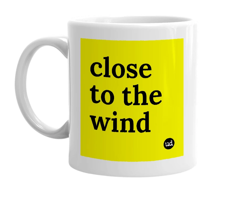 White mug with 'close to the wind' in bold black letters