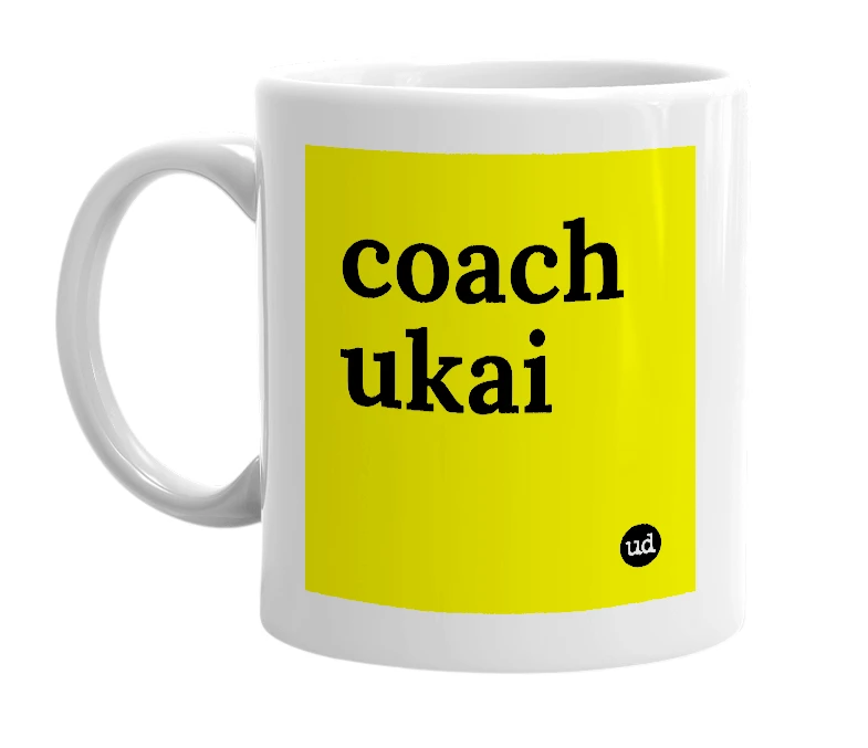White mug with 'coach ukai' in bold black letters