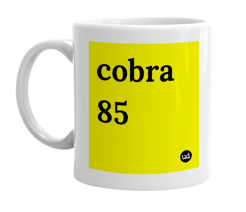 White mug with 'cobra 85' in bold black letters