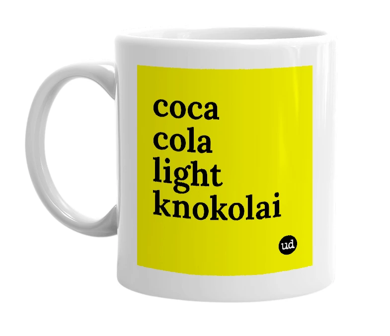 White mug with 'coca cola light knokolai' in bold black letters