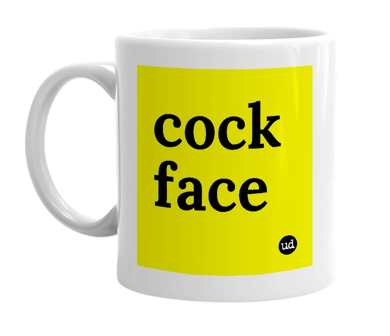 White mug with 'cock face' in bold black letters