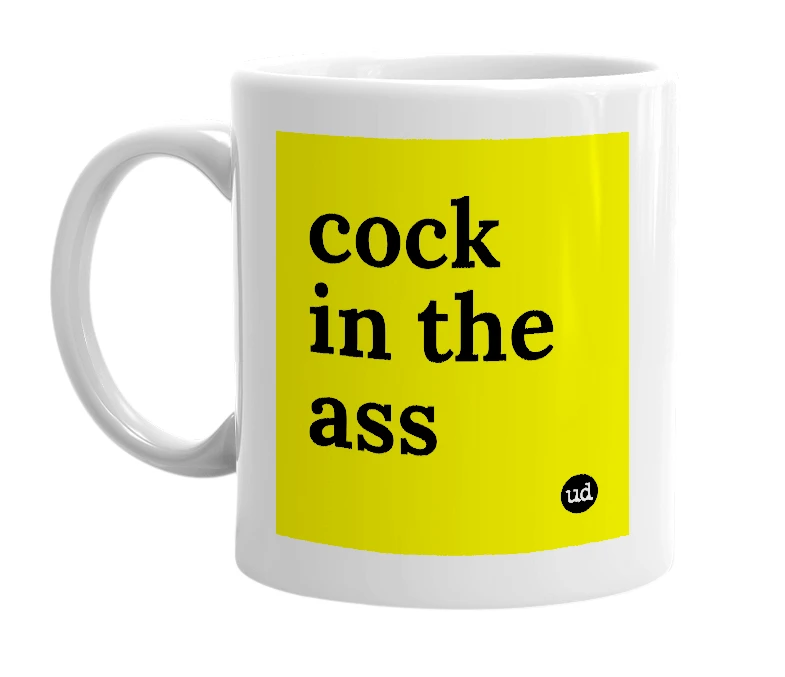 White mug with 'cock in the ass' in bold black letters