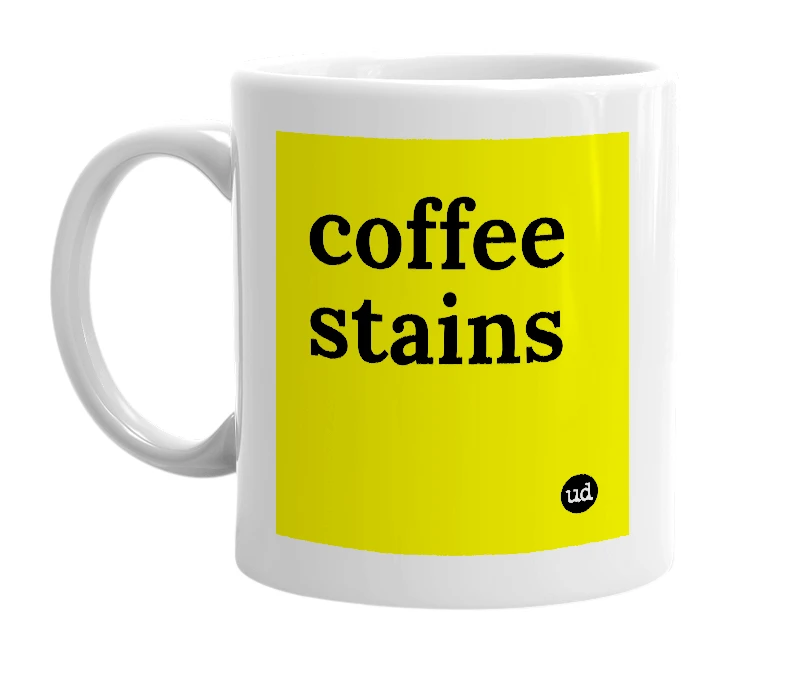 White mug with 'coffee stains' in bold black letters