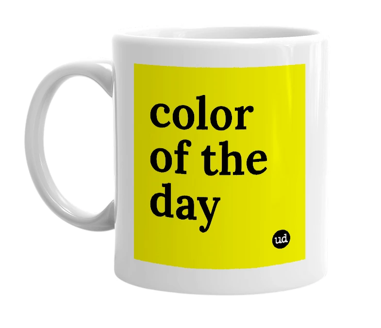 White mug with 'color of the day' in bold black letters