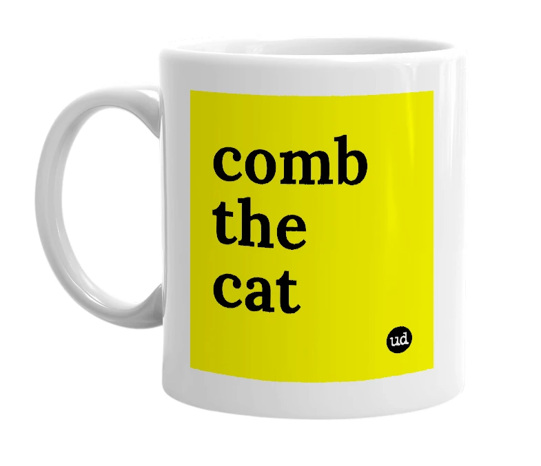 White mug with 'comb the cat' in bold black letters
