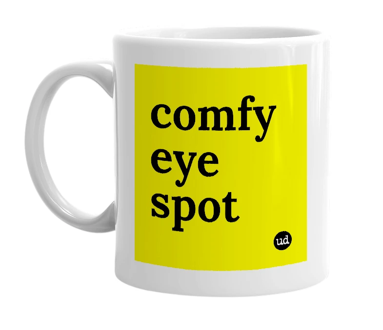 White mug with 'comfy eye spot' in bold black letters