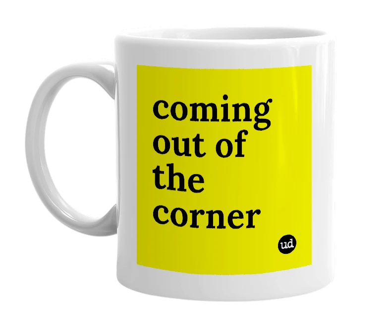White mug with 'coming out of the corner' in bold black letters