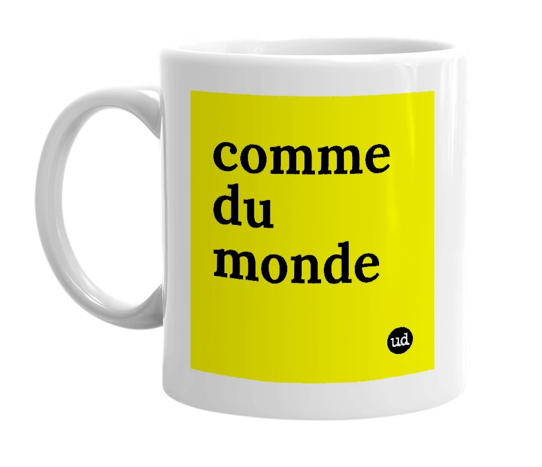 White mug with 'comme du monde' in bold black letters