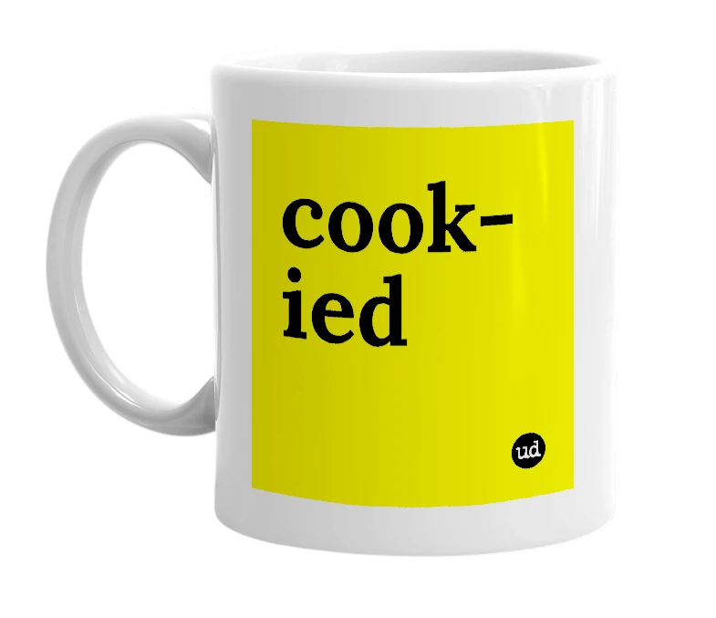 White mug with 'cook-ied' in bold black letters