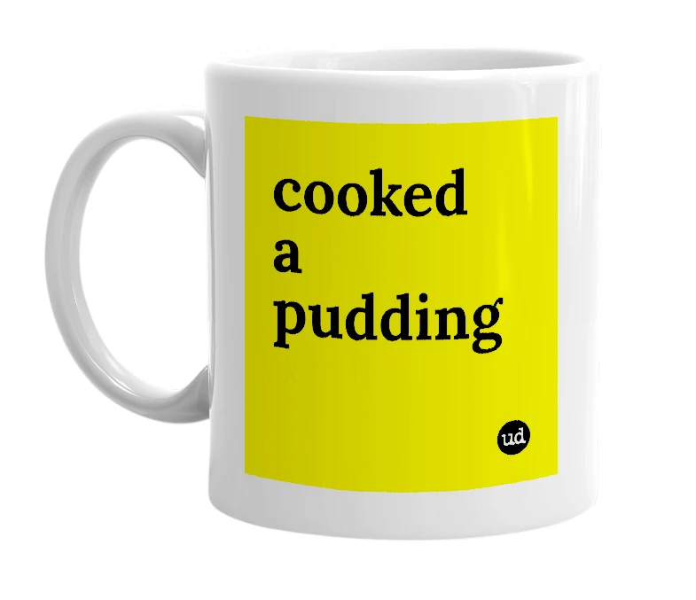 White mug with 'cooked a pudding' in bold black letters