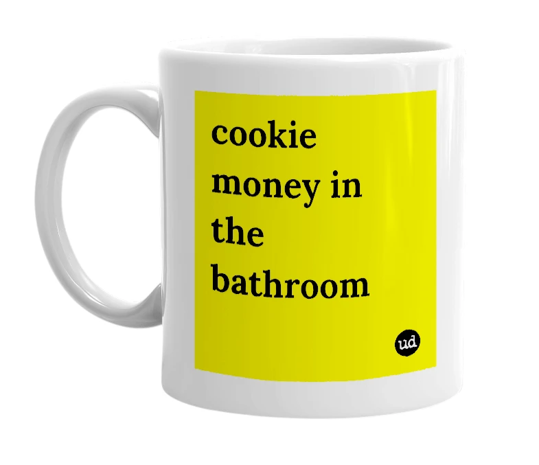 White mug with 'cookie money in the bathroom' in bold black letters