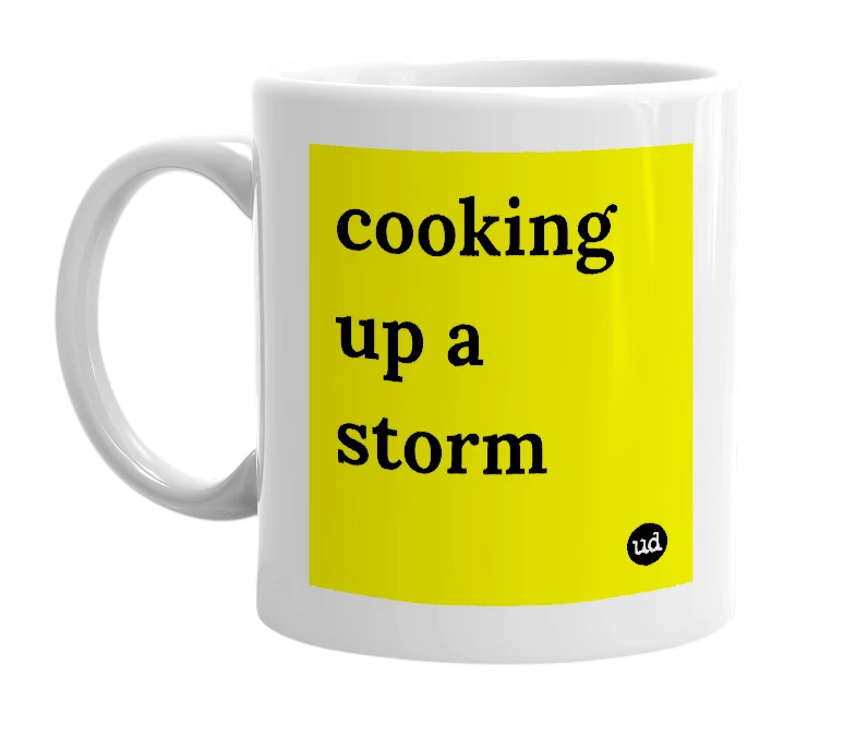 White mug with 'cooking up a storm' in bold black letters