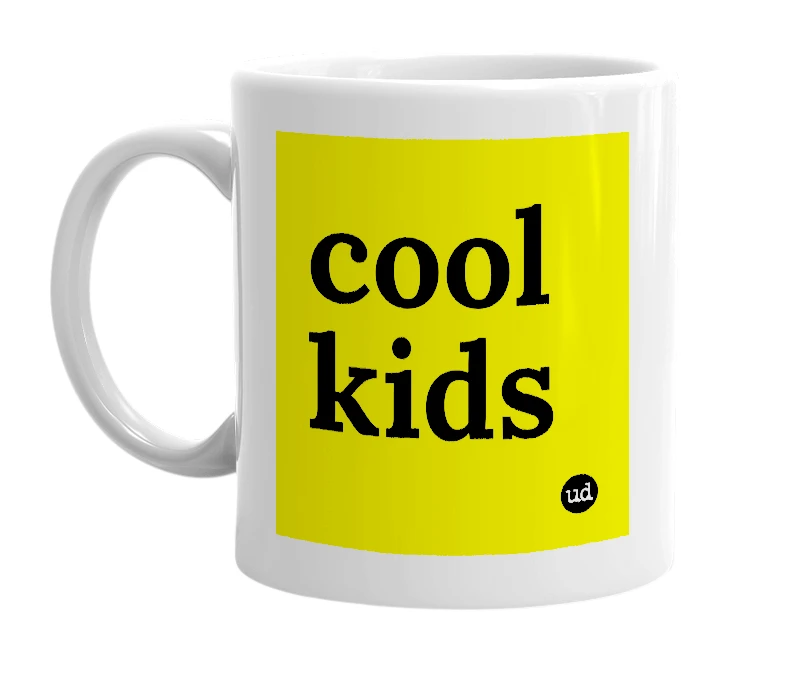 White mug with 'cool kids' in bold black letters