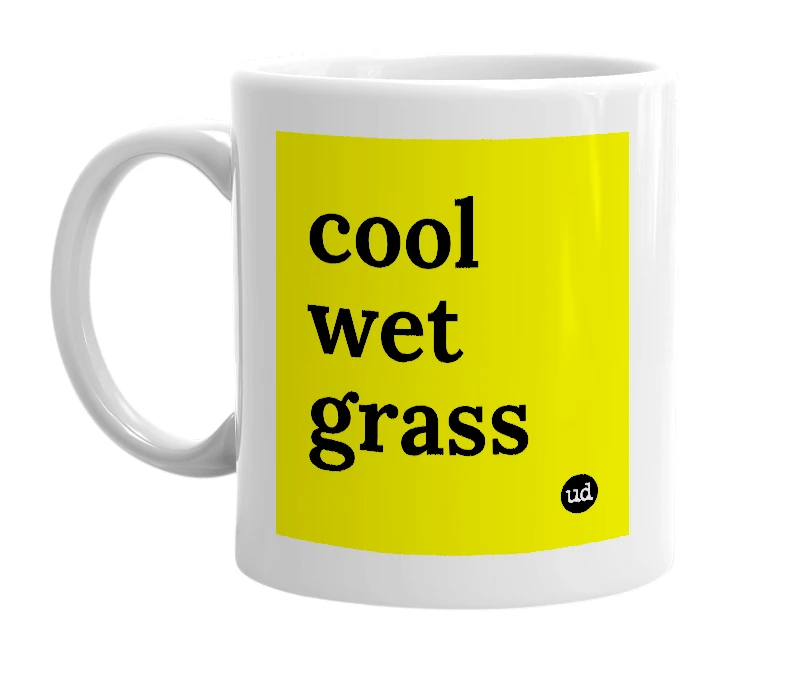 White mug with 'cool wet grass' in bold black letters