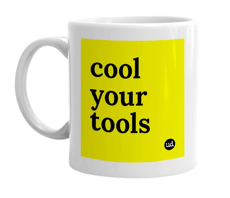 White mug with 'cool your tools' in bold black letters