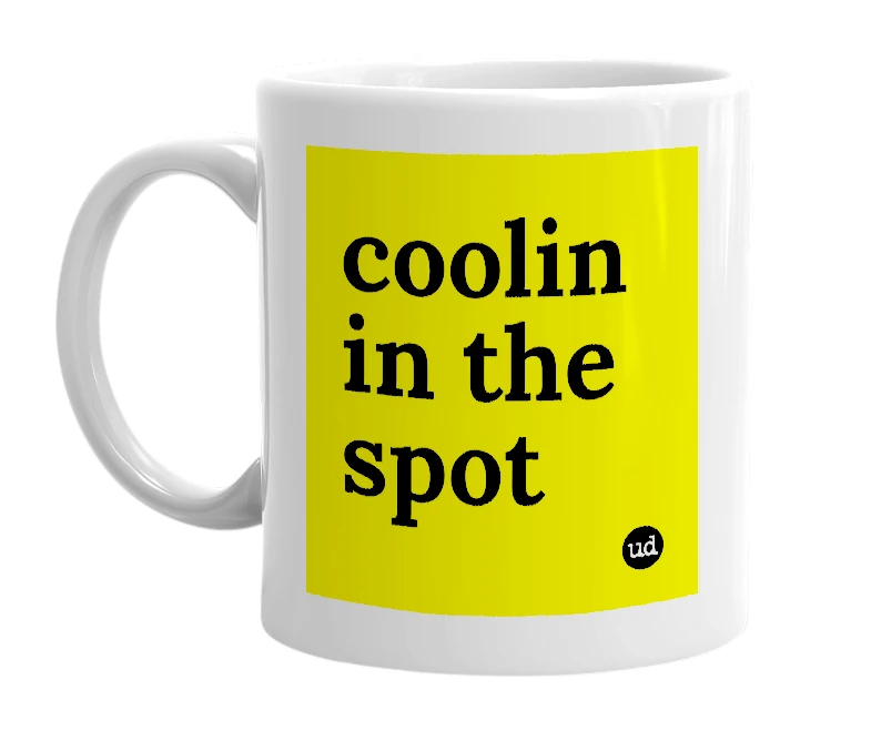 White mug with 'coolin in the spot' in bold black letters