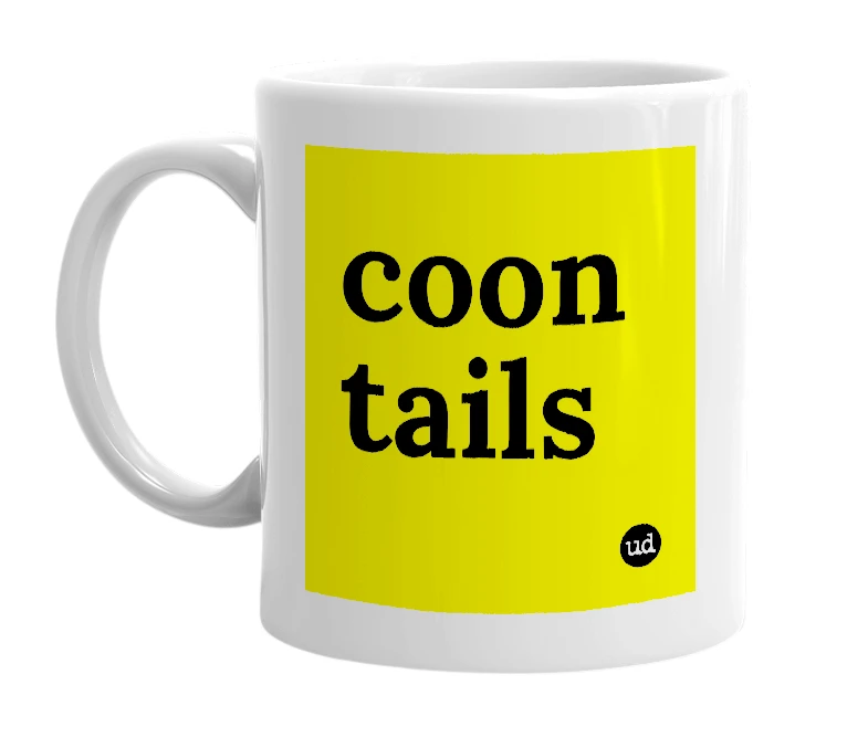 White mug with 'coon tails' in bold black letters