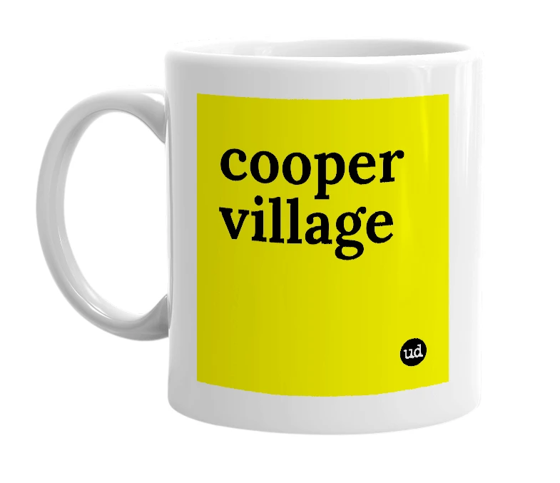 White mug with 'cooper village' in bold black letters