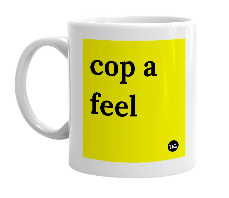 White mug with 'cop a feel' in bold black letters