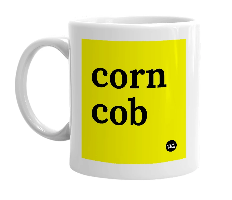 White mug with 'corn cob' in bold black letters