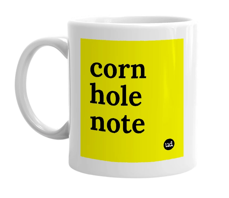 White mug with 'corn hole note' in bold black letters