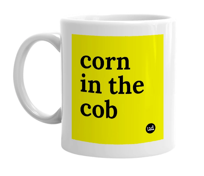 White mug with 'corn in the cob' in bold black letters