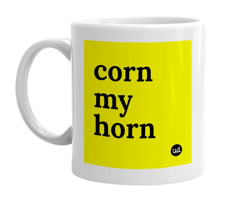 White mug with 'corn my horn' in bold black letters