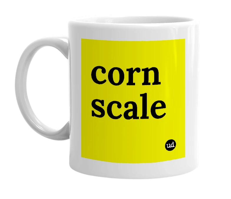 White mug with 'corn scale' in bold black letters