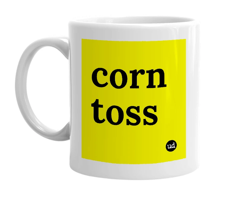 White mug with 'corn toss' in bold black letters