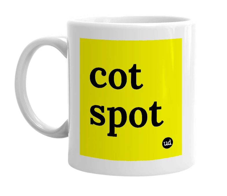 White mug with 'cot spot' in bold black letters