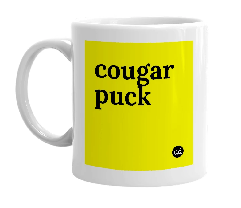White mug with 'cougar puck' in bold black letters