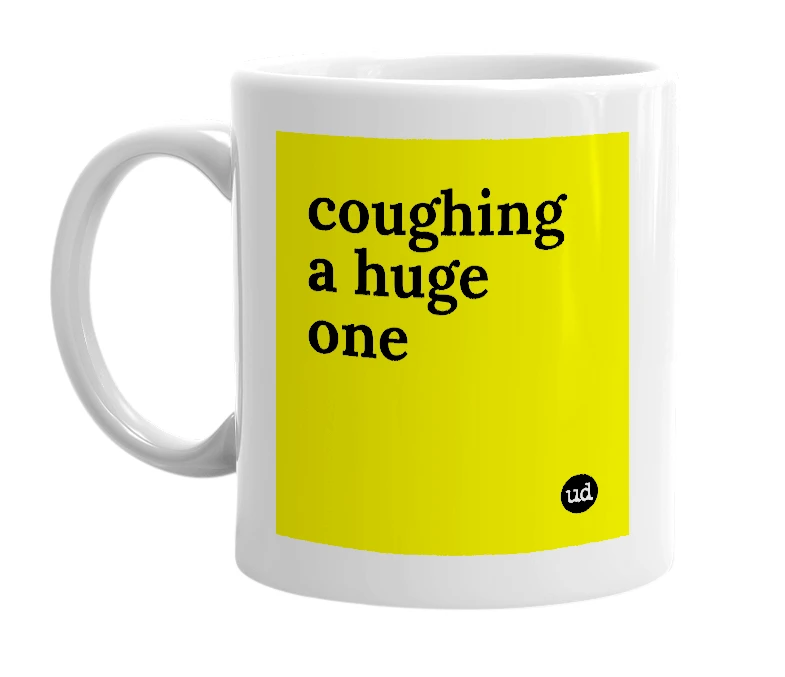 White mug with 'coughing a huge one' in bold black letters